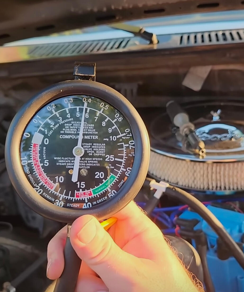 Mobile mechanic performing engine vacuum testing during vehicle diagnostics in Fort Worth Texas